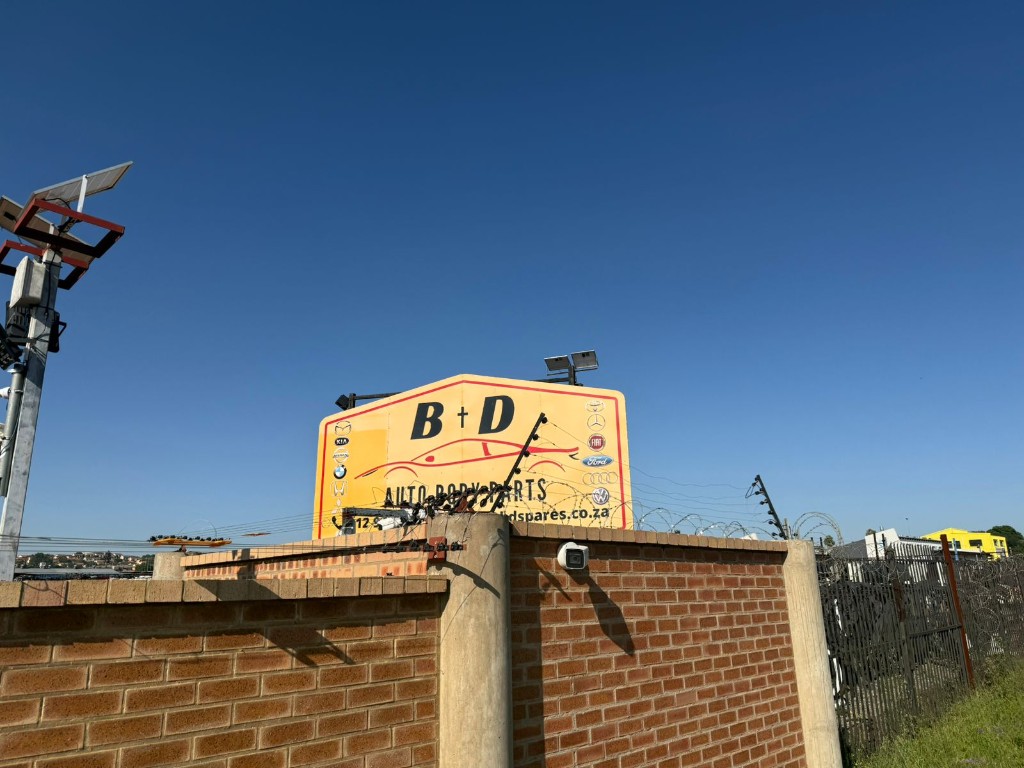 B+D Auto Body Parts large yellow shop sign by Plan Photo Repro