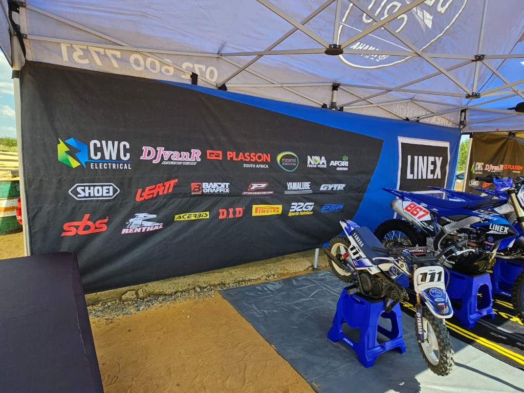 Linex Yamaha Racing pit setup with bikes #111 and #867 and sponsor backdrop by Plan Photo Repro