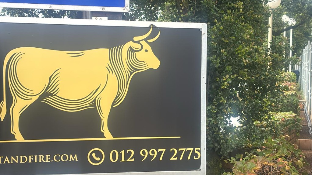 Veldt & Fire Butchery gold bull outdoor signage by Plan Photo Repro