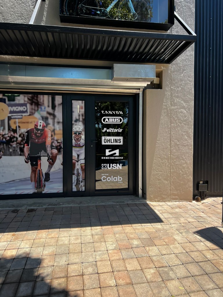 we are Colab.com cycling shop window graphics and door decals by Plan Photo Repro